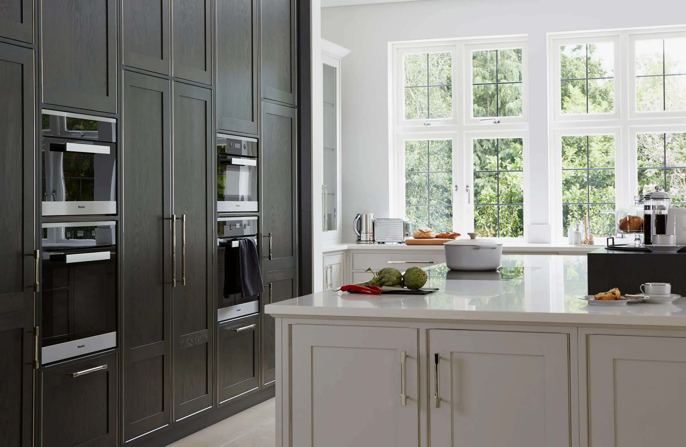 Kitchen with dark oak tall units and a pale painted island, Kingston