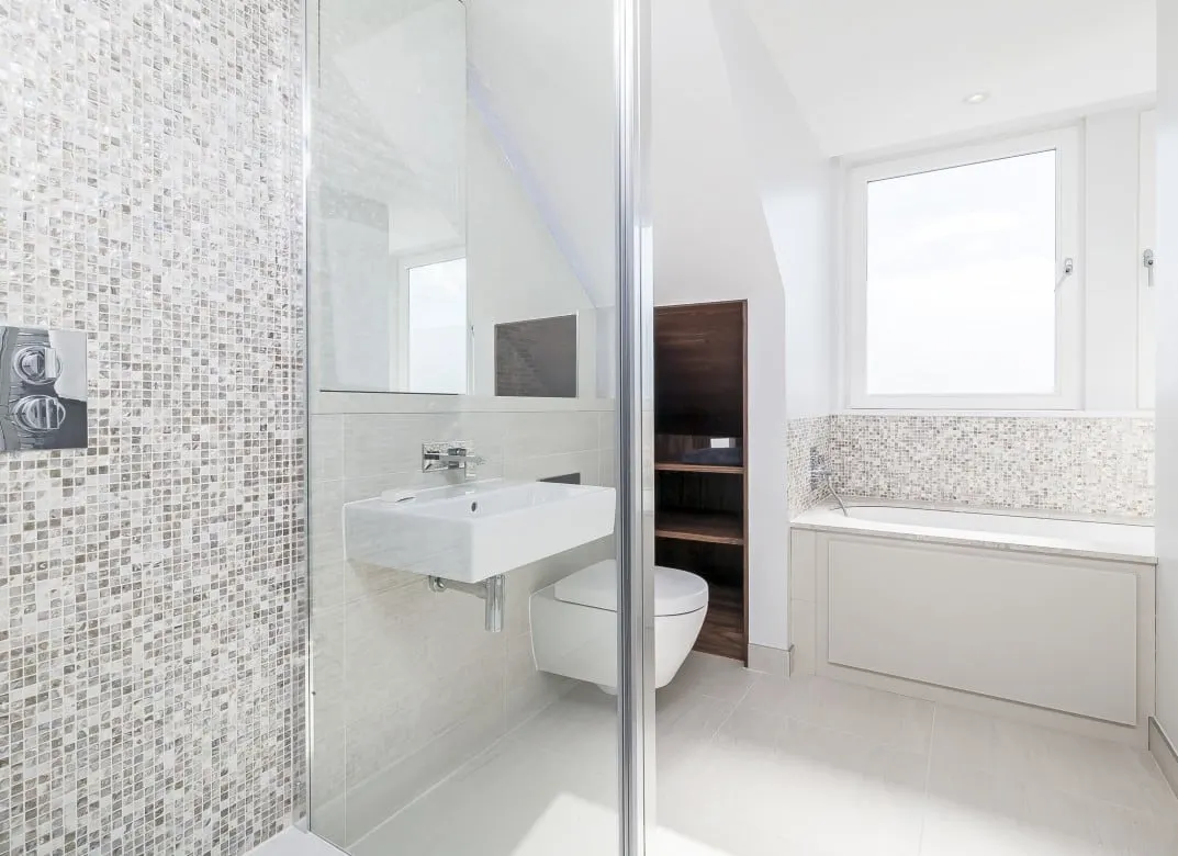 Bathroom with a mosaic feature wall and a frameless glass shower screen, Teddington